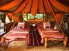 Elephant Watch Camp, two matching twin beds decorated in traditional African style full of colors and patterns in a safari tent, Africa safari, Kenya
